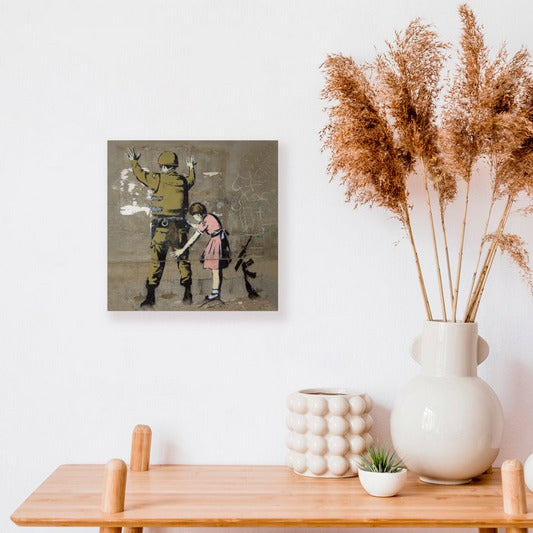 Banksy Canvas Wall Art Banksy Girl Frisking Soldier 30x30 Cm banksy-canvas-wall-art-banksy-girl-frisking-soldier-30x30-cm