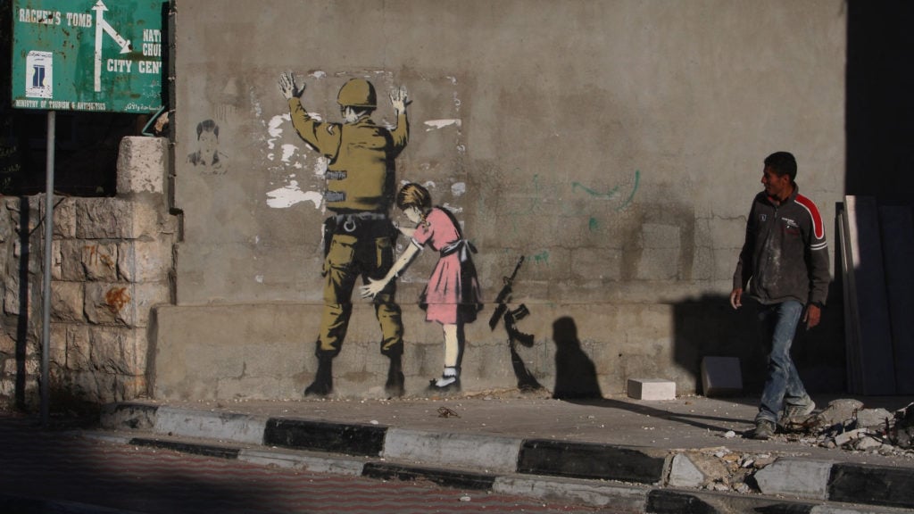 Banksy Canvas Wall Art "Banksy Girl Frisking Soldier" 30x30 cm